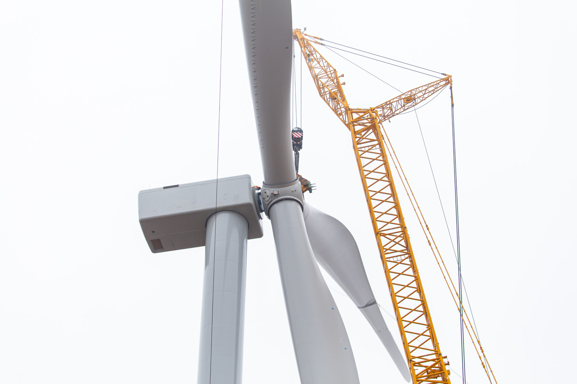 Close-up of windmill with crane